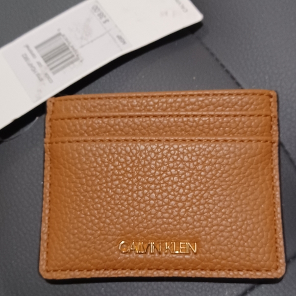 CALVIN KLEIN ID FLAT TAN BROWN LOGO WALLET
MEASURE - Picture 5 of 7